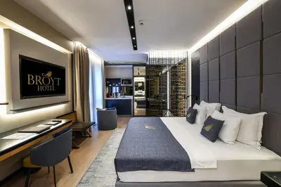 a hotel room with a bed and a desk and a kitchen at Broyt Hotel in Istanbul