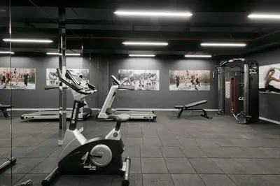 a gym with two exercise bikes and a treadmill at Avantgarde Urban Sisli in Istanbul