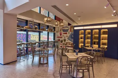 a dining room with tables and chairs in a restaurant at Avantgarde Urban Sisli in Istanbul