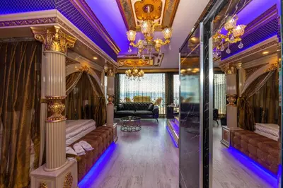 a living room with couches and a chandelier at Istanbul Taksim Residence Hotel By MESUT in Istanbul