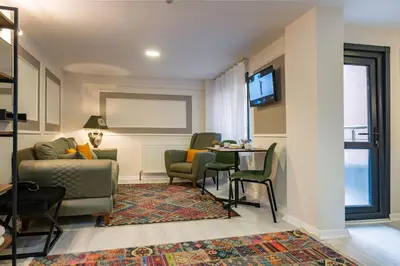 a living room with a couch and a table at BLUE MARMARA SUITES in Istanbul