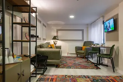 a living room with a couch and a table at BLUE MARMARA SUITES in Istanbul