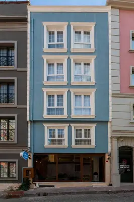 a blue building on the side of a street at BLUE MARMARA SUITES in Istanbul