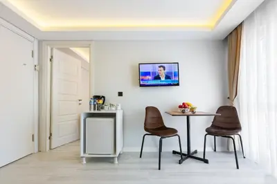 a dining room with a table and two chairs at BLUE MARMARA SUITES in Istanbul