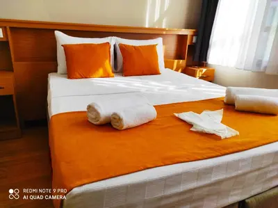a bedroom with a bed with towels on it at Lebon Hotel-Special Class in Istanbul