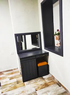 a dressing room with a mirror and a cabinet at Lebon Hotel-Special Class in Istanbul