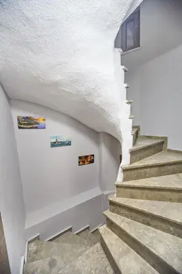 a staircase in a house with white walls at Luna Suites Taksim in Istanbul