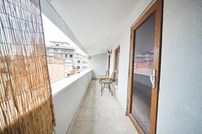 an empty balcony with a door and a chair on it at Luna Suites Taksim in Istanbul