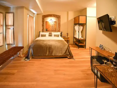 a bedroom with a bed and a television in it at Maravilloso Hotel Pera in Istanbul