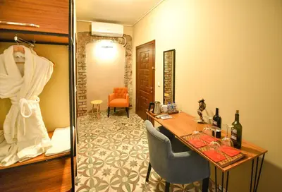 a hotel room with a desk and a room at Maravilloso Hotel Pera in Istanbul