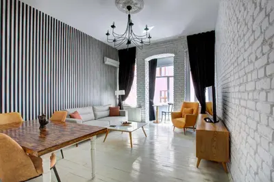 a living room with a couch and a table at Maravilloso Hotel Galata in Istanbul