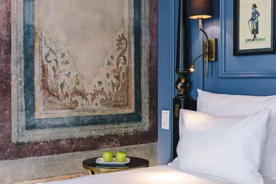 a bedroom with a bed and a table with apples on it at The Soul Istanbul Hotel in Istanbul
