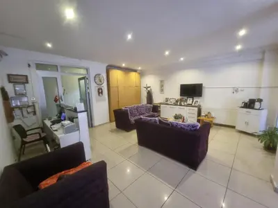 a living room with two couches and a tv at Thermal Orkide Pansiyon in Yalova