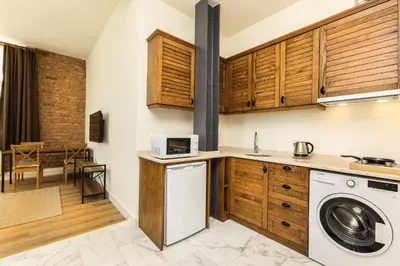 a kitchen with a washer and dryer at The Nomad Inn Old City İstanbul in Istanbul