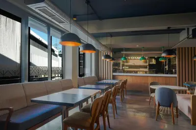 a row of tables and chairs in a restaurant at Four Points Flex by Sheraton Bursa Nilüfer in Bursa