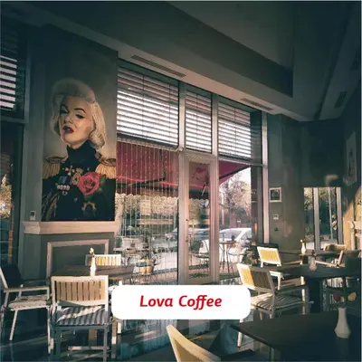 a restaurant with a large painting of a woman on the wall at Yalova Lova Hotel & SPA Yalova in Yalova