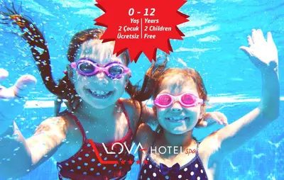 two girls in a swimming pool with a red star at Yalova Lova Hotel & SPA Yalova in Yalova