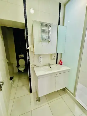a bathroom with a white sink and a toilet at İmmortal Hotel İstanbul in Istanbul