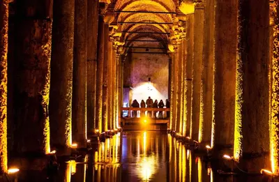 a hallway of a building with people walking through it at İmmortal Hotel İstanbul in Istanbul