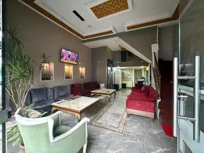 a living room with a couch and a table at RHYTHM HOTEL in Istanbul