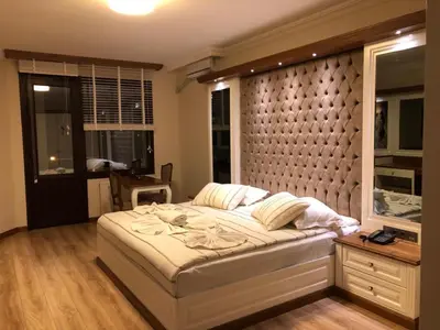 a bedroom with a large bed and a window at Blue Pier Hotel in Kocaeli
