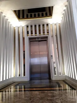 a hallway with a glass door in a building at Blue Pier Hotel in Kocaeli