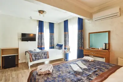 a hotel room with a bed and a television at Armar Hotel in Istanbul