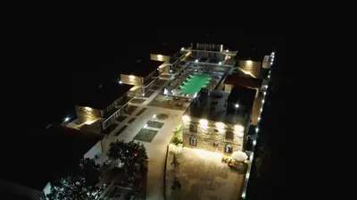 a large building with lights on it at night at İğneada Hotel Rezve in Kırklareli