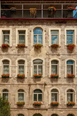 a brick building with windows and flower boxes at World House Boutique Hotel Galata in Istanbul