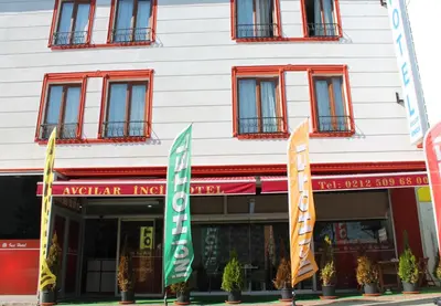 a building with flags in front of it at Avcılar İnci Hotel in Istanbul