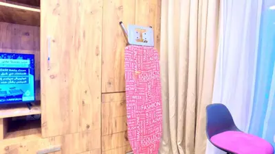 a snowboard hanging on a wall next to a chair at NOUR SUITE & RESIDENCE in Istanbul