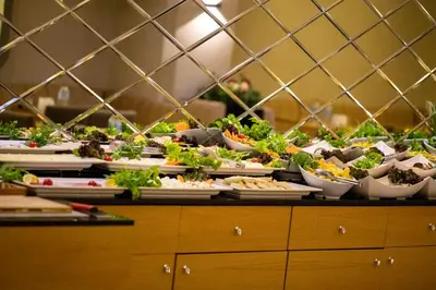 a buffet with many plates of food on a table at THE GREEN HOTEL in Istanbul