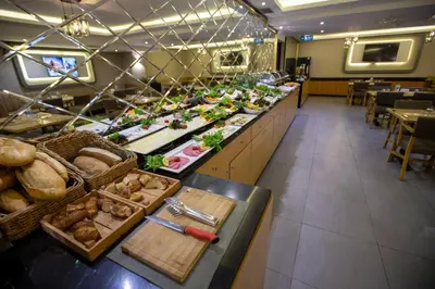 a buffet line with many different types of food at THE GREEN HOTEL in Istanbul