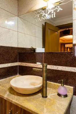 a sink in a bathroom with a mirror at Kervanchi in Istanbul