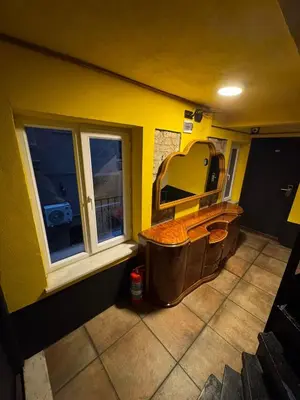 an empty bathroom with a sink and two windows at Reu de Hotel in Istanbul