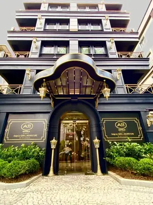 a store front of a blue building with a doorway at A11 HOTEL Exclusive in Istanbul