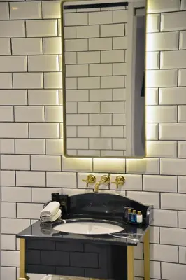 a bathroom with a sink and a mirror at A11 HOTEL Exclusive in Istanbul