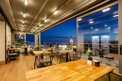 a restaurant with tables and chairs and a view of the city at Santra Hotel in Istanbul