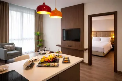 a hotel room with a table with fruit on it at Prime Istanbul Residences in Istanbul