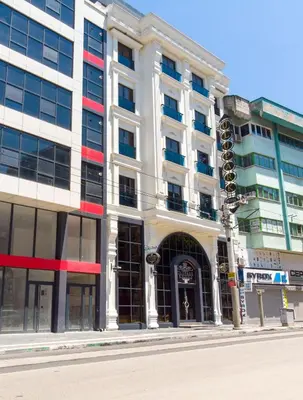 a large white building on a city street at Bursa Ulupark Hotel in Bursa