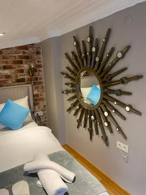 a bedroom with a mirror on the wall at Bosphorus Bridge in Istanbul