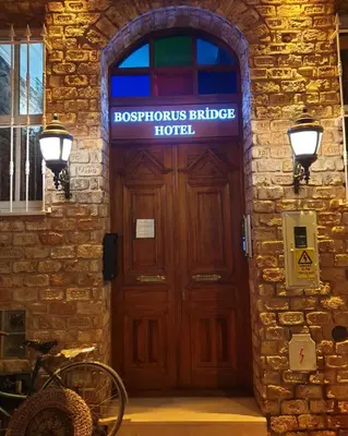 a building with a wooden door with a sign on it at Bosphorus Bridge in Istanbul