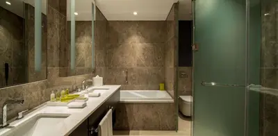 a bathroom with a tub and a sink and a shower at Hilton Mall Of Istanbul in Istanbul
