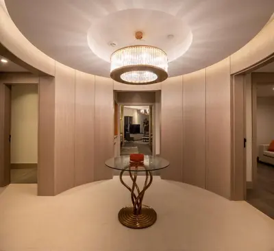 a dining room with a table and a chandelier at Hilton Mall Of Istanbul in Istanbul