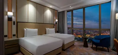 a hotel room with a bed and a large window at Hilton Mall Of Istanbul in Istanbul