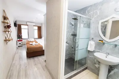 a bathroom with a shower and a sink at Kupa HOTEL in Istanbul