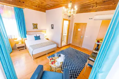 a bedroom with a bed and a couch at Acacia Mansion Hotel in Istanbul
