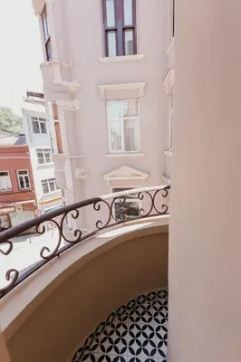 a balcony of a building with a spiral staircase at Galadoo Suites in Istanbul