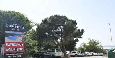 a bunch of cars parked in a parking lot at DOUBLE ROYAL HOTEL in Kocaeli
