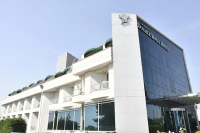 a building with a sign on the side of it at DOUBLE ROYAL HOTEL in Kocaeli